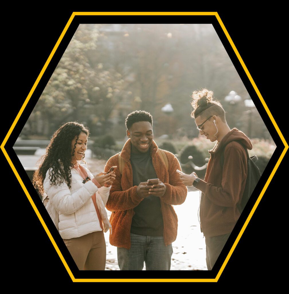 Three young people on their phones in an octagon thumbnail